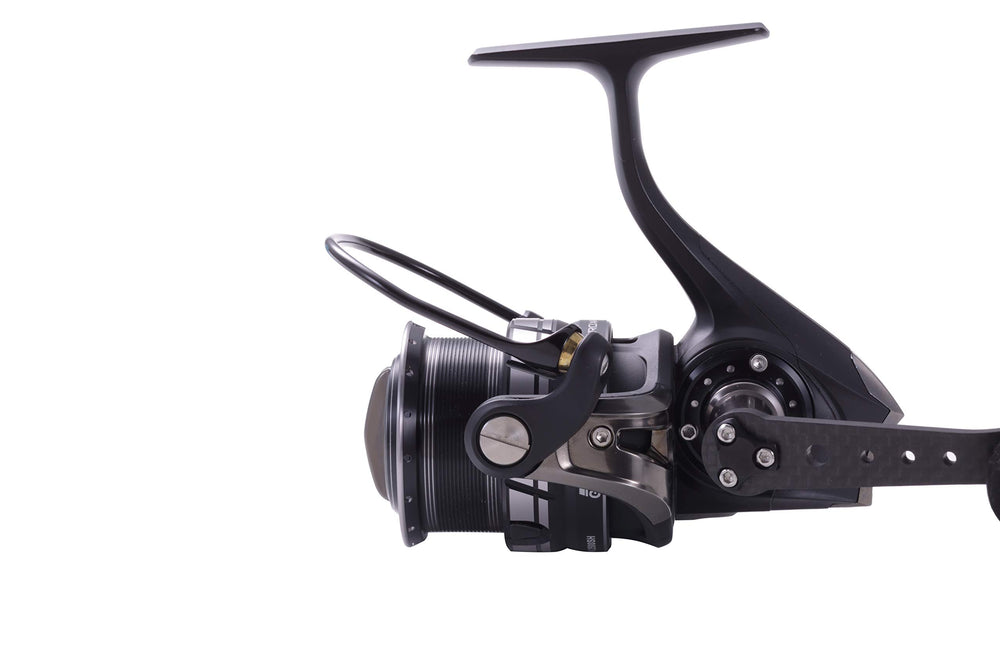 Pinion gear with salt shield bearing for saltwater durability