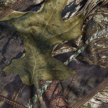 AC ALLEN Vanish balaclava blends with forest camouflage for concealment