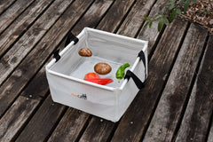 AceCamp durable vinyl basin demonstrates compact storage and portability