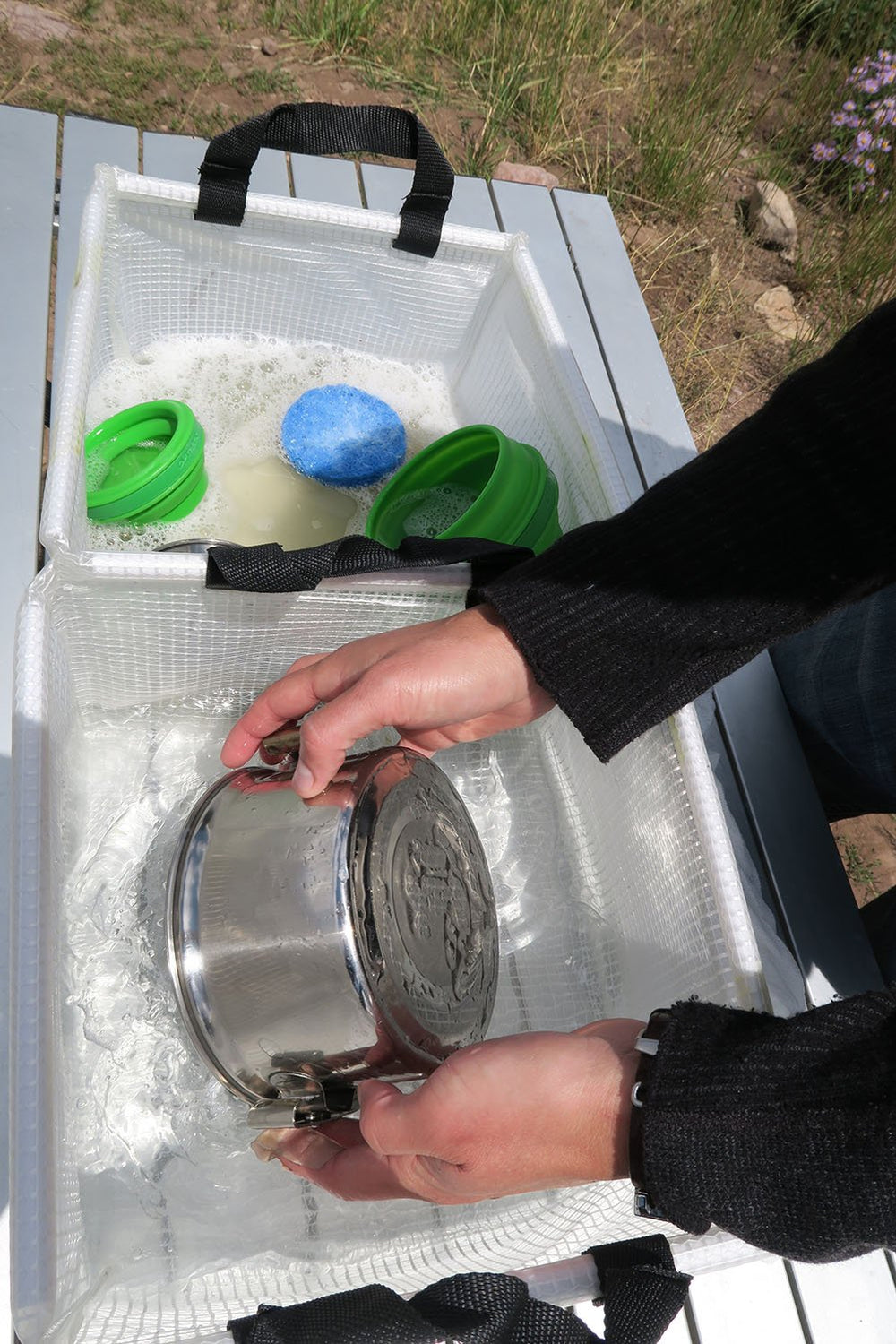 AceCamp portable bin with handles ready for camping.