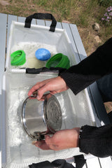 AceCamp portable bin with handles ready for camping.