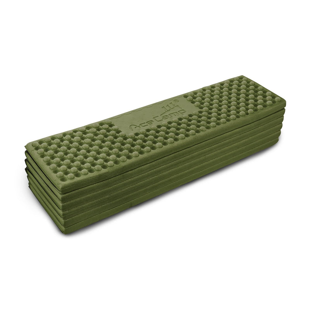 AceCamp sleeping pad green color shown in outdoor setting for gear organization