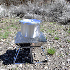 AceCamp Tribal Pot in a camping scene ready for outdoor meals.