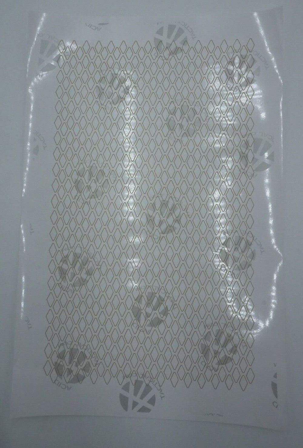 Acid Tactical camouflage stencil for angled surfaces aiding contoured camouflage on gear.