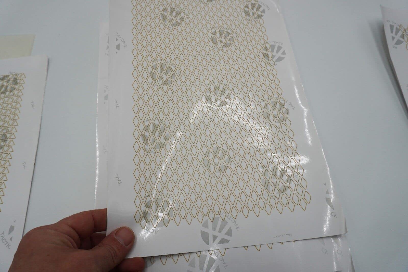 Acid Tactical camouflage stencil tips for trimming and precise placement.