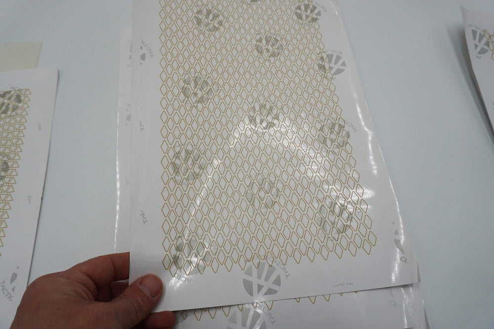 Acid Tactical camouflage stencil tips for trimming and precise placement.