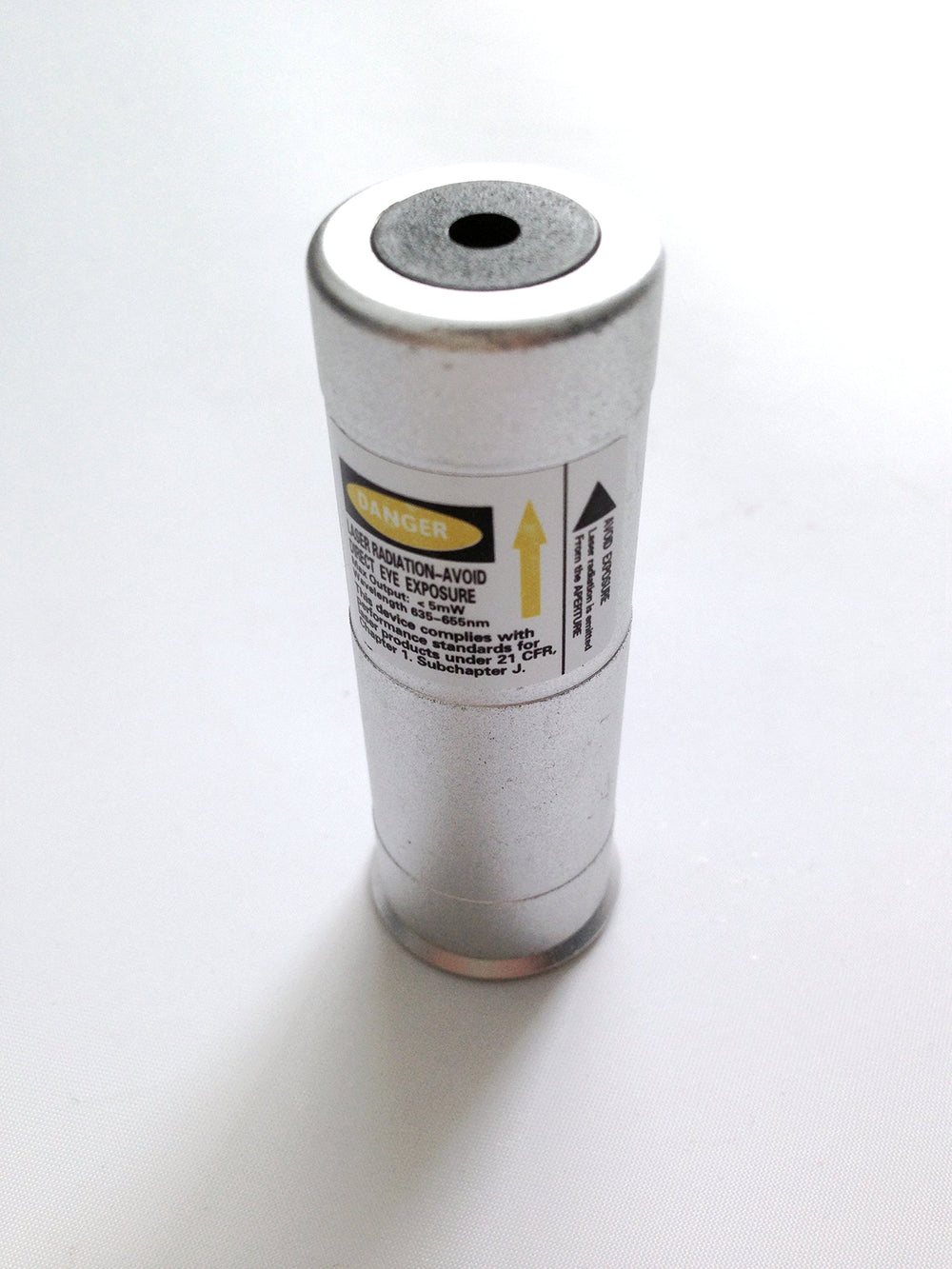 Ade Advanced Optics Class 3R Premium 12-Gauge barrel-mount laser beam illuminates target at distance
