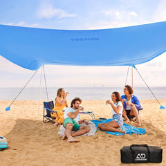 ADesign windproof beach tent with sandbags stabilizes shade on windy beaches.