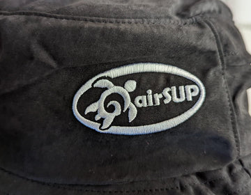 airSUP Bucket Hat worn by a paddler during stand up paddle surfing
