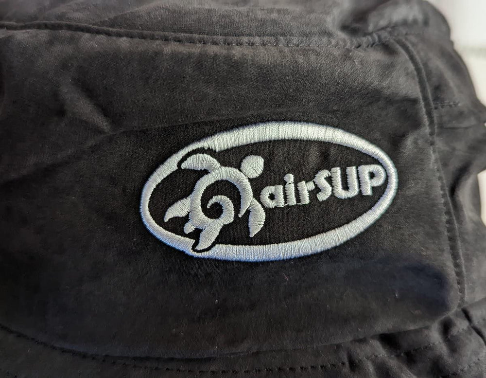 airSUP Bucket Hat worn by a paddler during stand up paddle surfing