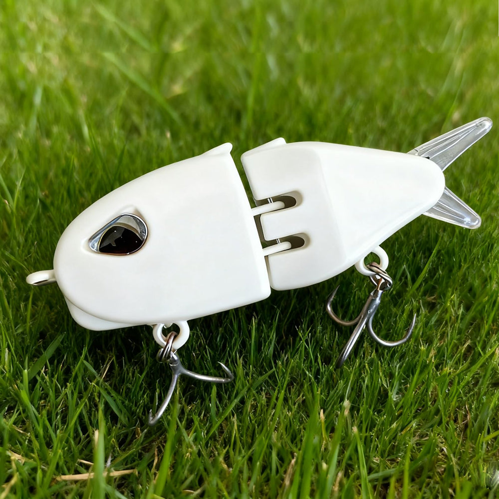 Angler casting with glide bait for bass in freshwater