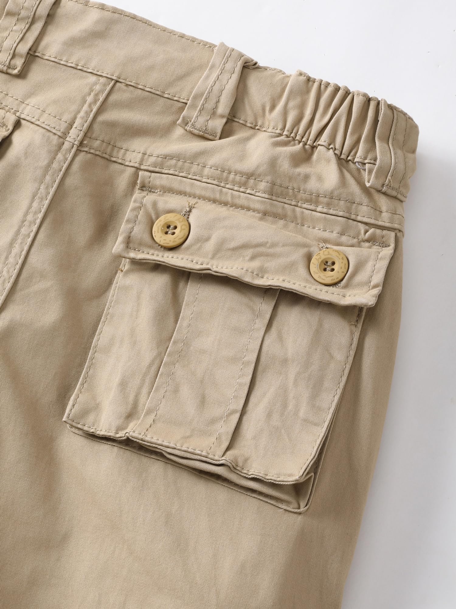 AKHIKING pants detail highlights sturdy zipper and buttons for rugged wear.