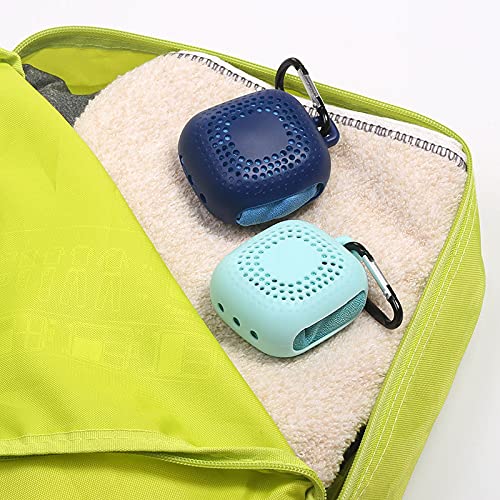 AKOAK towel shown hanging from a backpack for hands-free transport.