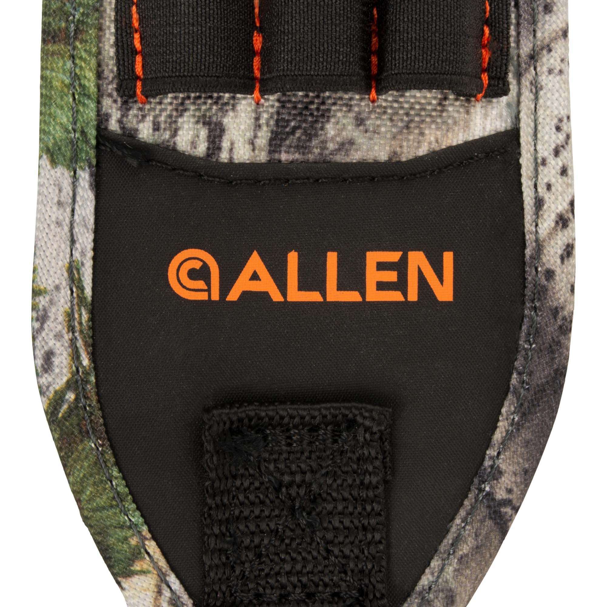 Hunting field setup with rifle sling in camouflage