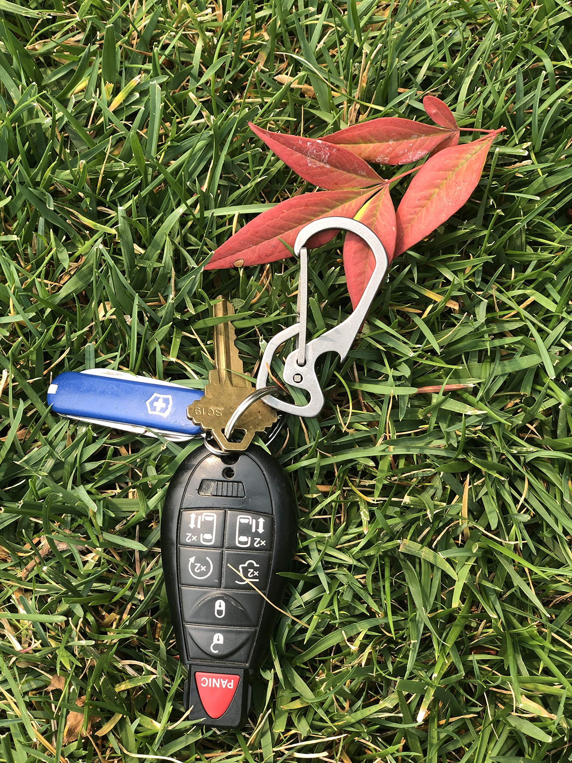 AllGear ultralight titanium keychain at 60mm minimizes pocket bulk.