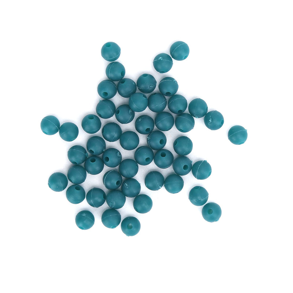 Beads reducing drag on deep-water carp rigs for smoother line flow