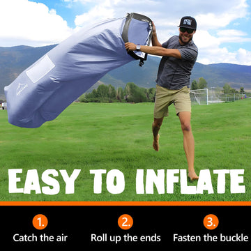AlphaBeing inflatable lounger with ergonomic headrest providing neck support at the beach.