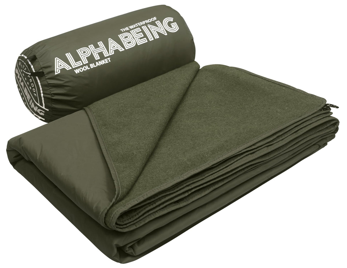AlphaBeing waterproof outdoor blanket in olive folded for compact carry and storage