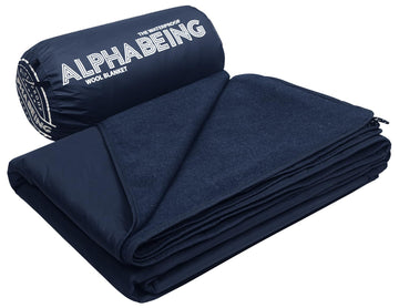 AlphaBeing waterproof outdoor blanket packed in its storage bag for travel