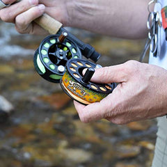 Stripee ReelBandz on a full-sized reel showing universal fit