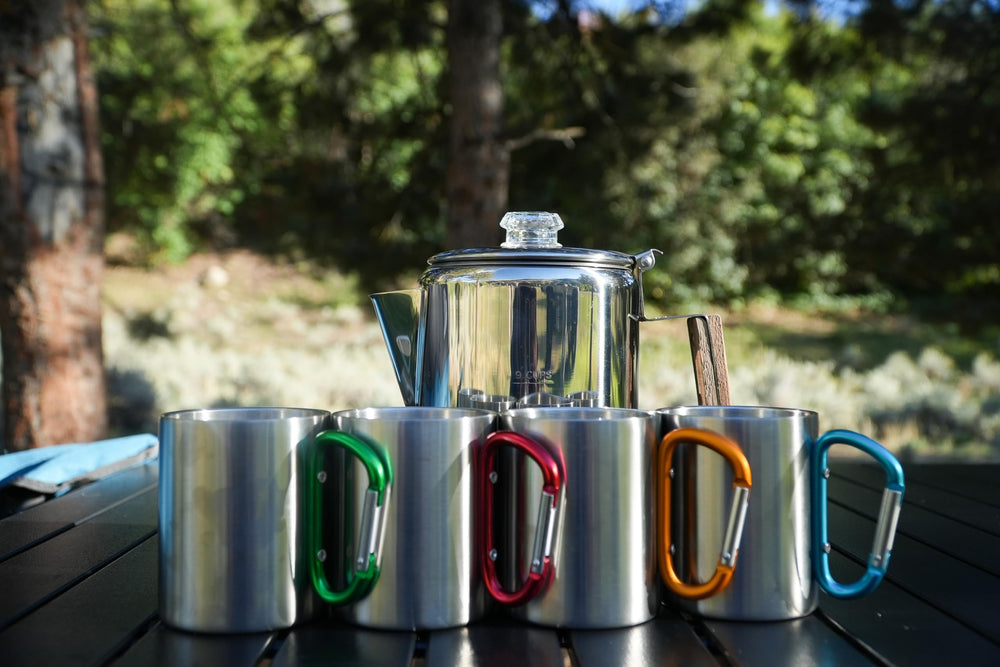 Alpine Mountain Gear percolator brewing over campfire for a rich brew.