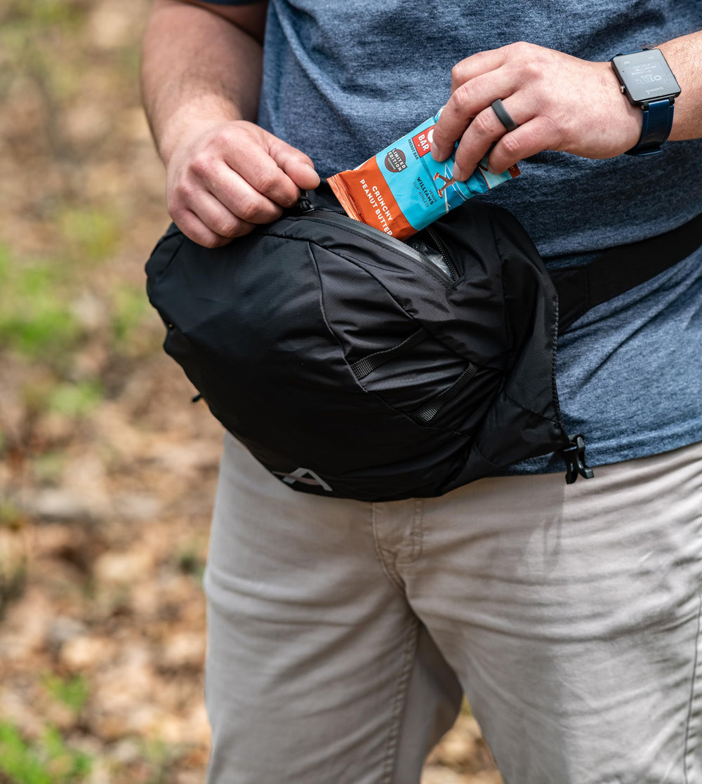 ALPS Mountaineering Caldera 90L pack rain cover keeps contents dry.