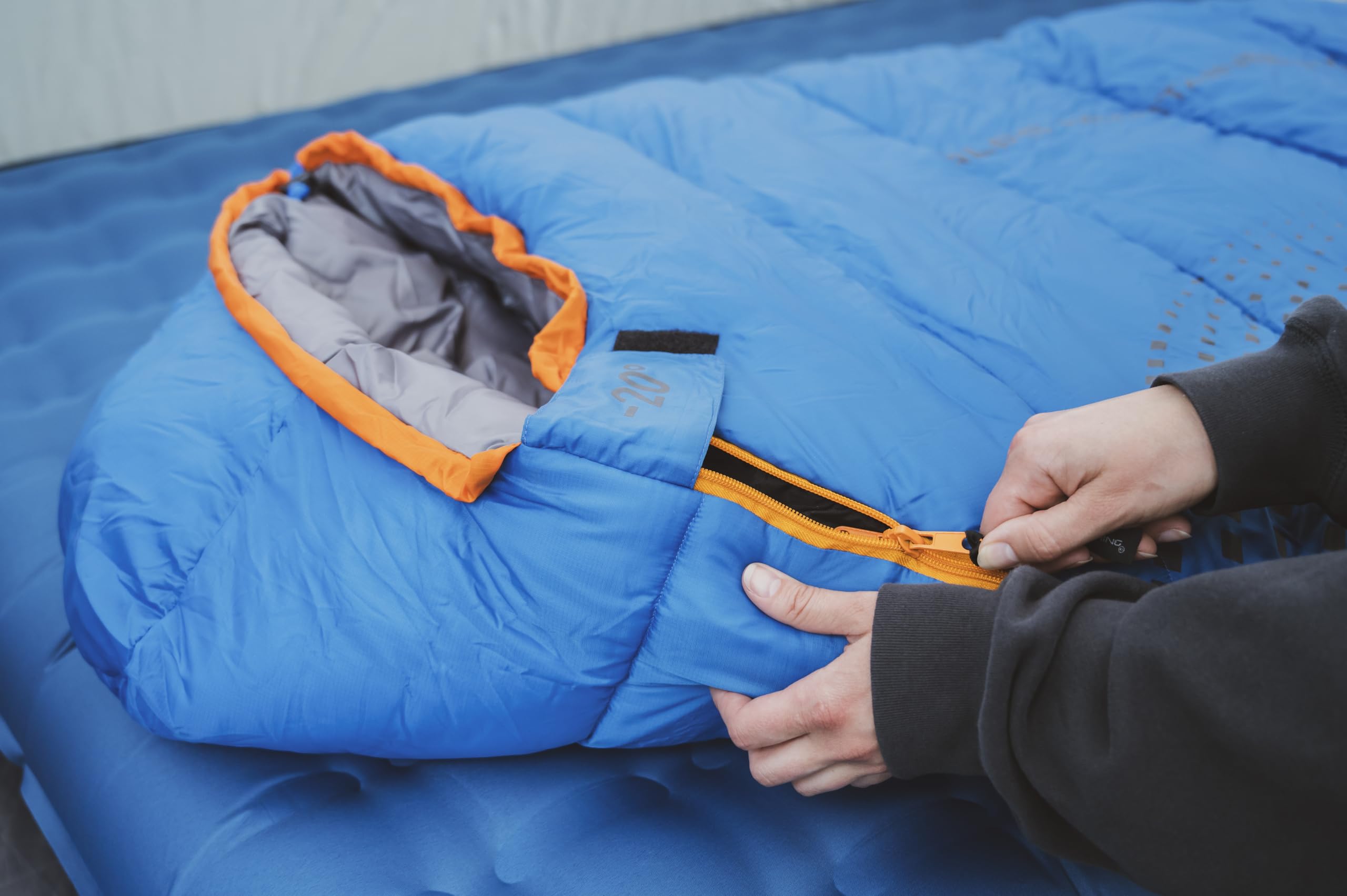 Zipper and draft-baffle close-up shows heat retention in ALPS Blaze