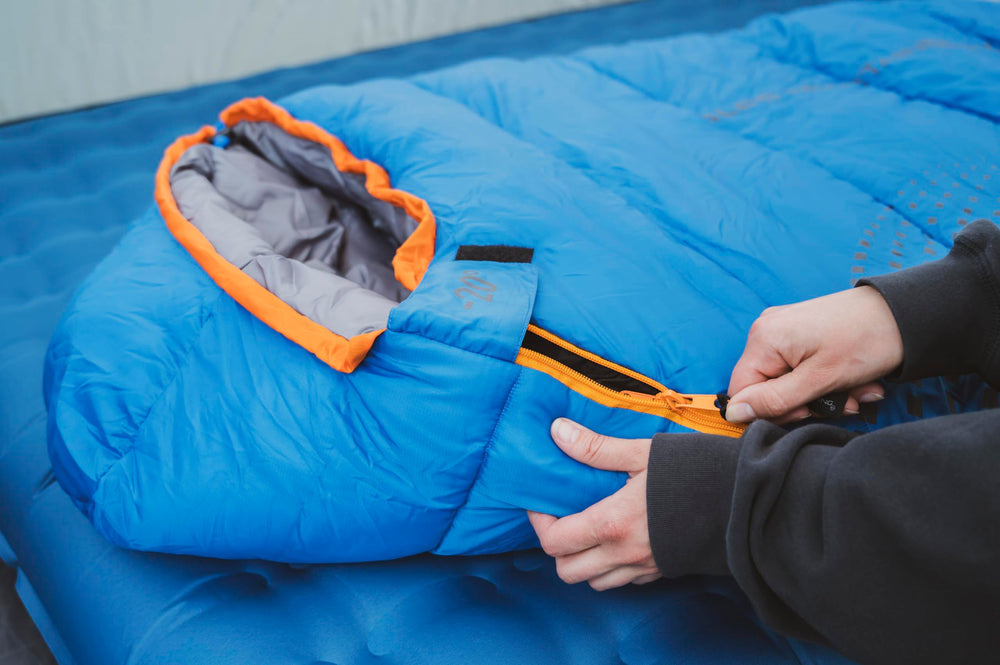 Zipper and draft-baffle close-up shows heat retention in ALPS Blaze