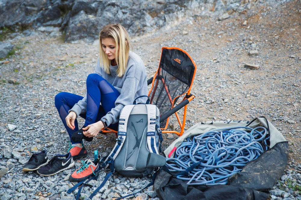 ALPS Mountaineering Hydro Trail 17L built-in rain cover protects gear during showers.