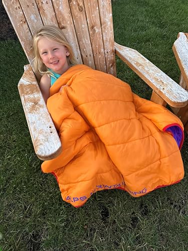 ALPS Stargaze blanket in Sunset carried in its compact stuff sack for travel