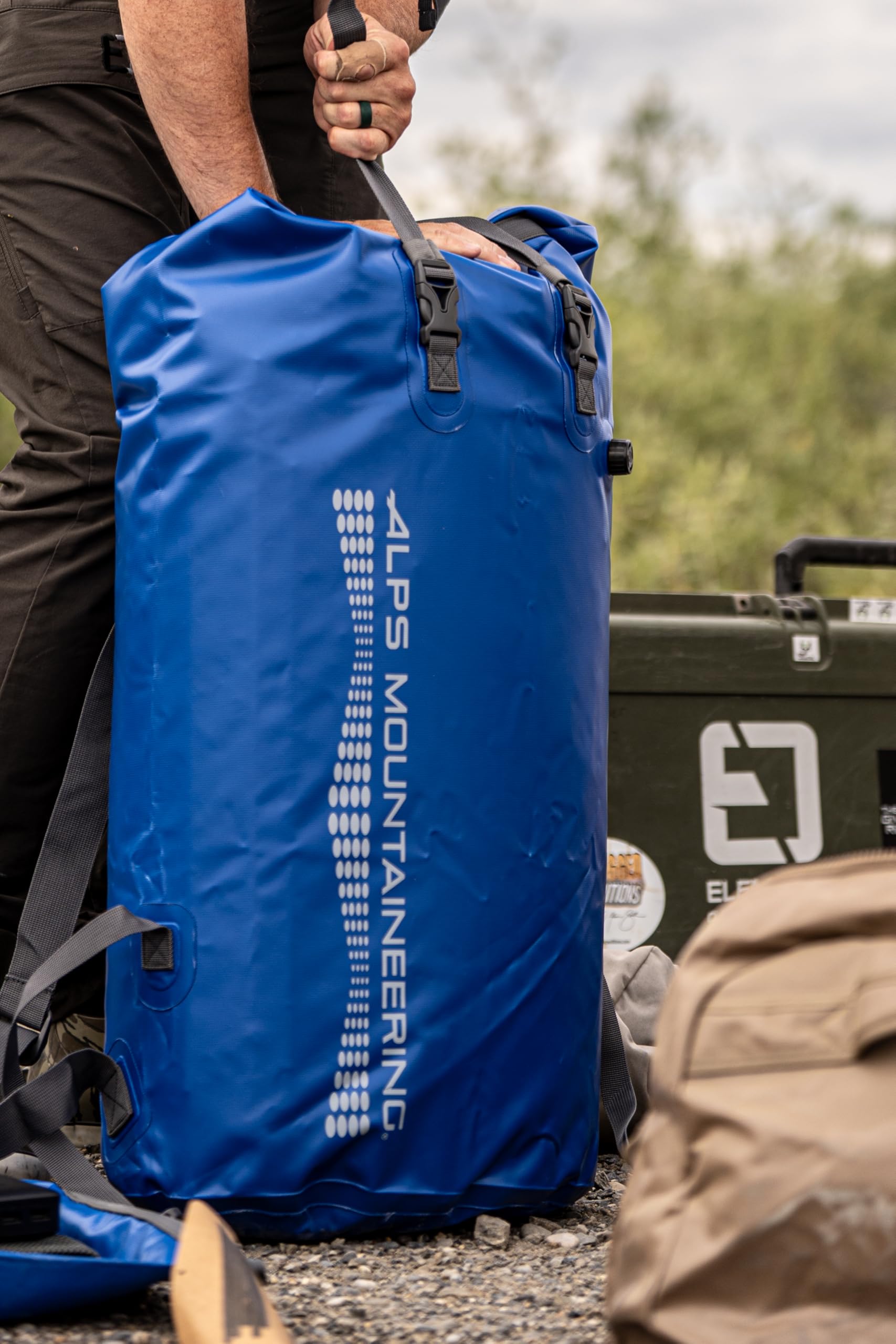 ALPS Mountaineering Torrent top compression strap secures rolled closure