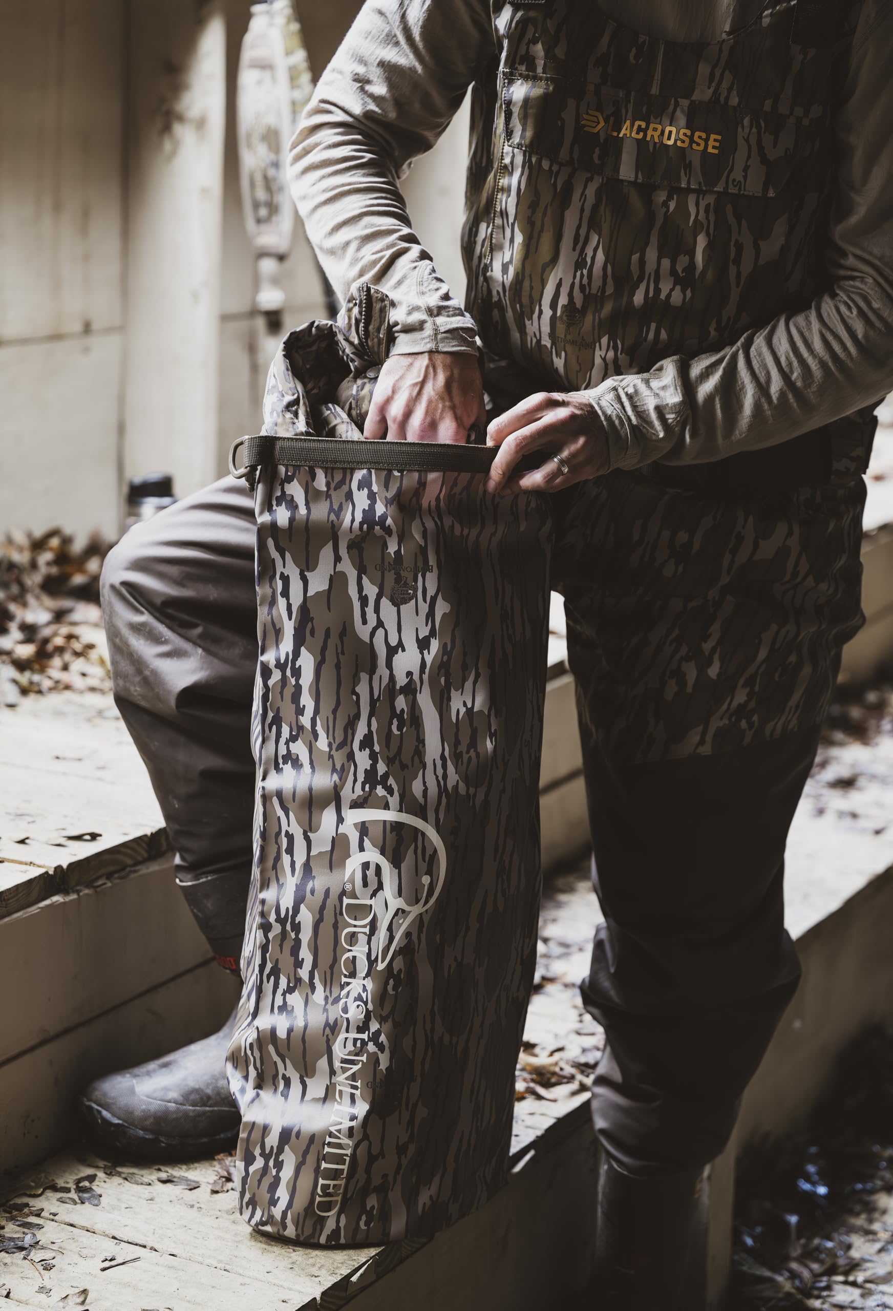 Mossy Oak Original Bottomland camouflage blends with field surroundings.