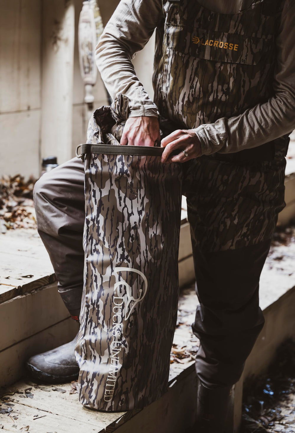 Mossy Oak Original Bottomland camouflage blends with field surroundings.