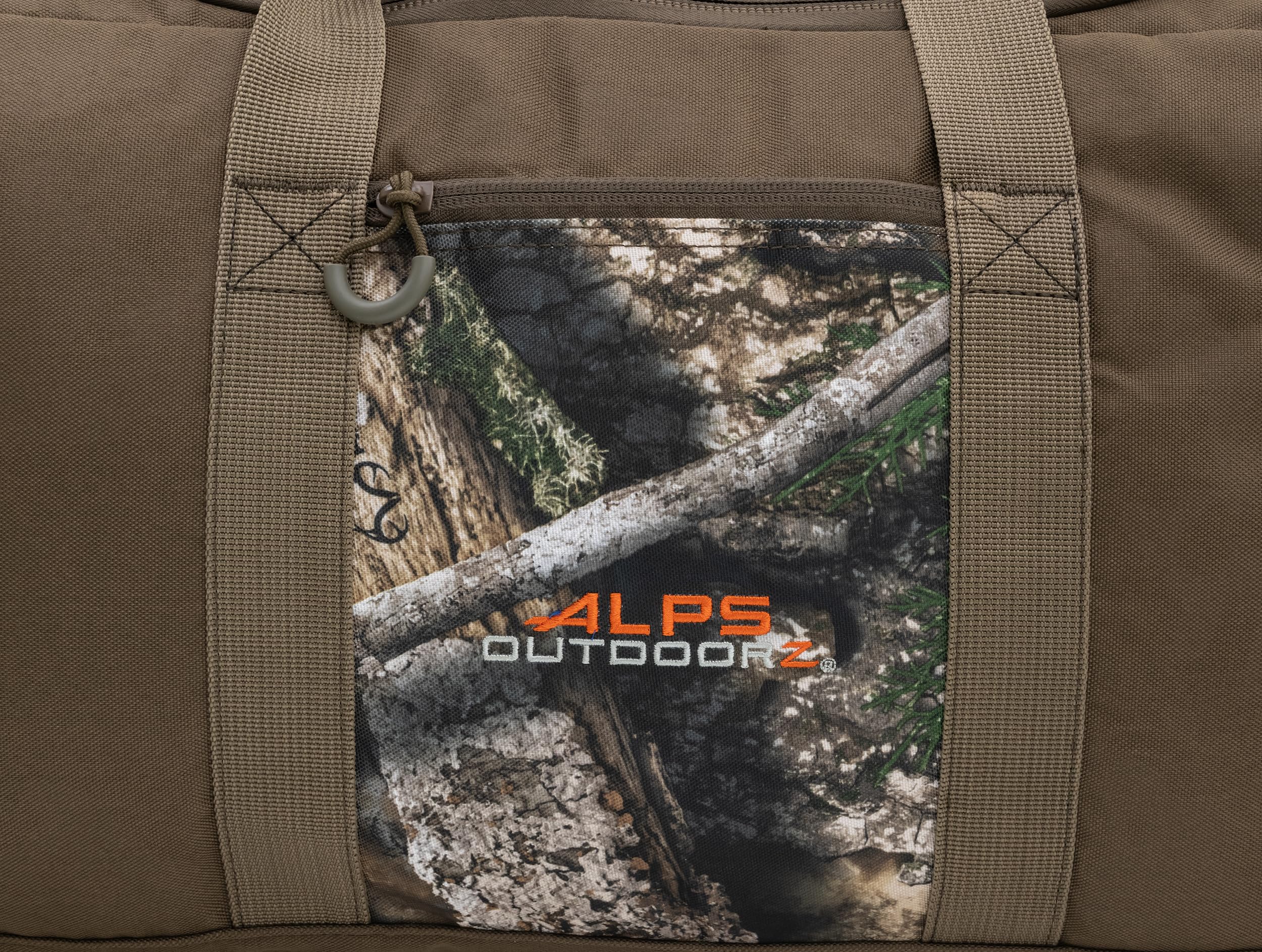 ALPS OutdoorZ High Caliber Duffel side pocket ideal for small essentials during trips.