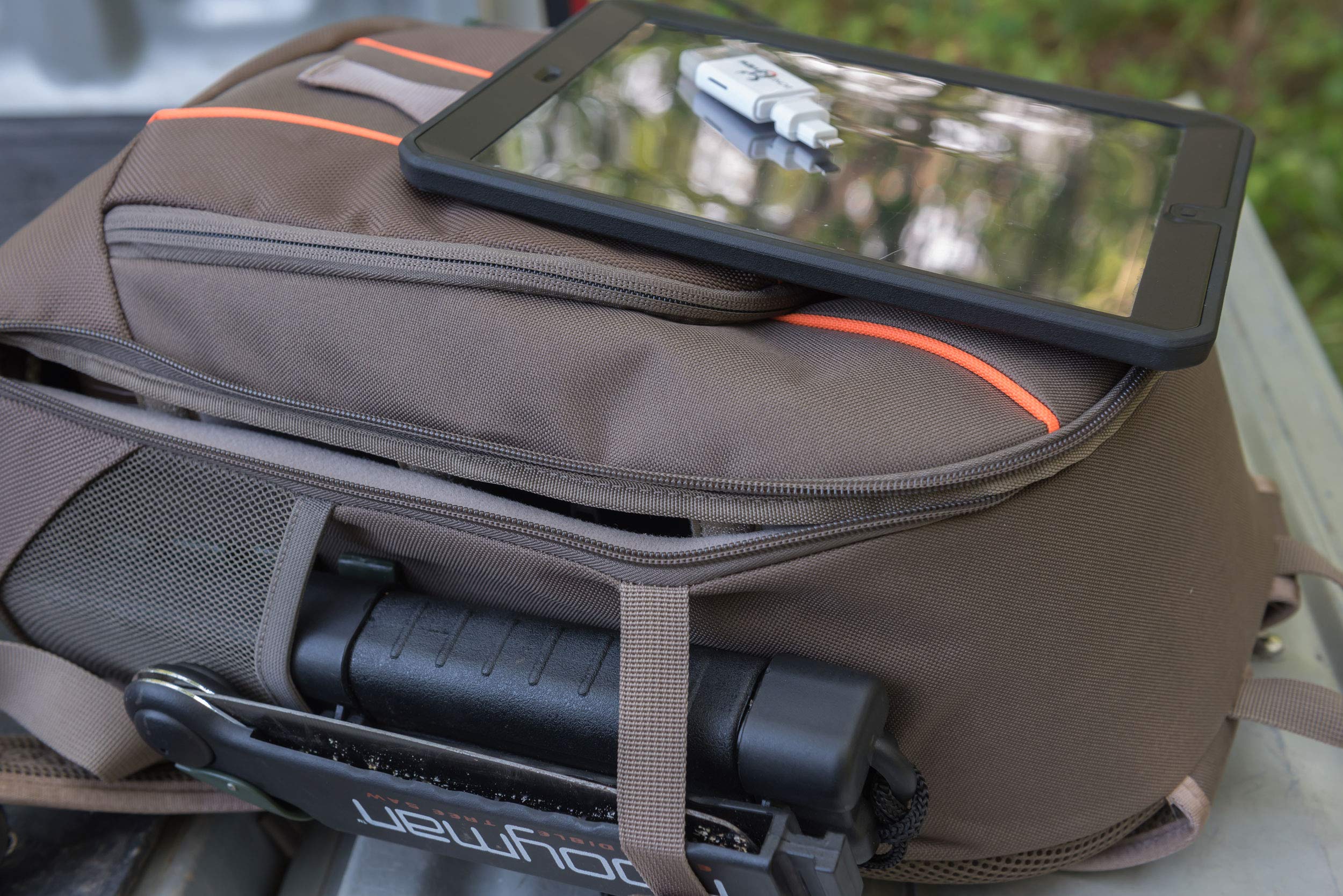 Compression straps secure tools for safer transport in rugged terrain.