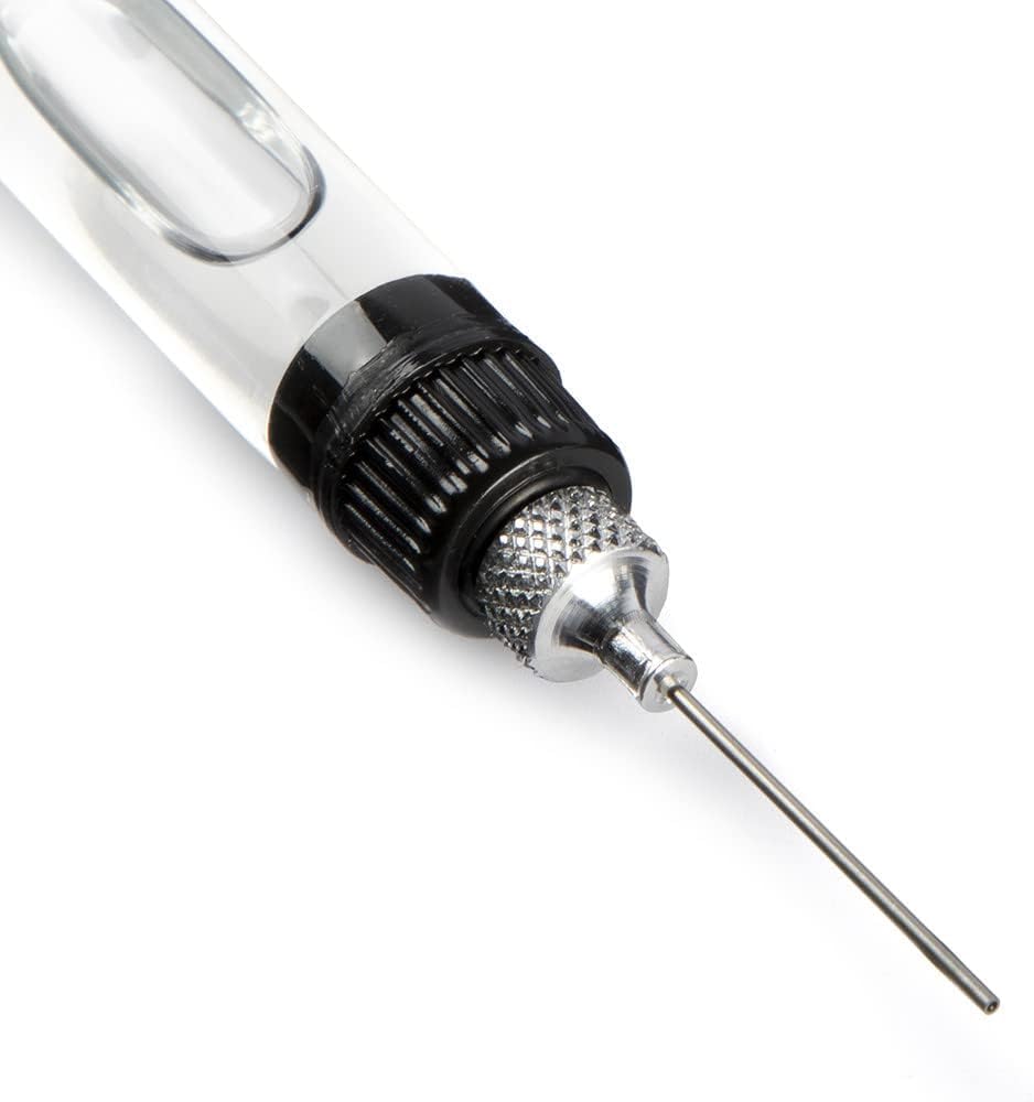 Al's Goldfish Lure Precision Oiler Pen needle close for exact application.