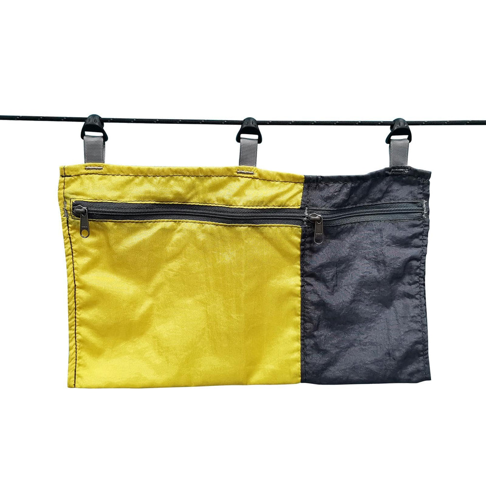 Amagogo Hammock Organizer Bag yellow attached to a tree keeps essentials handy