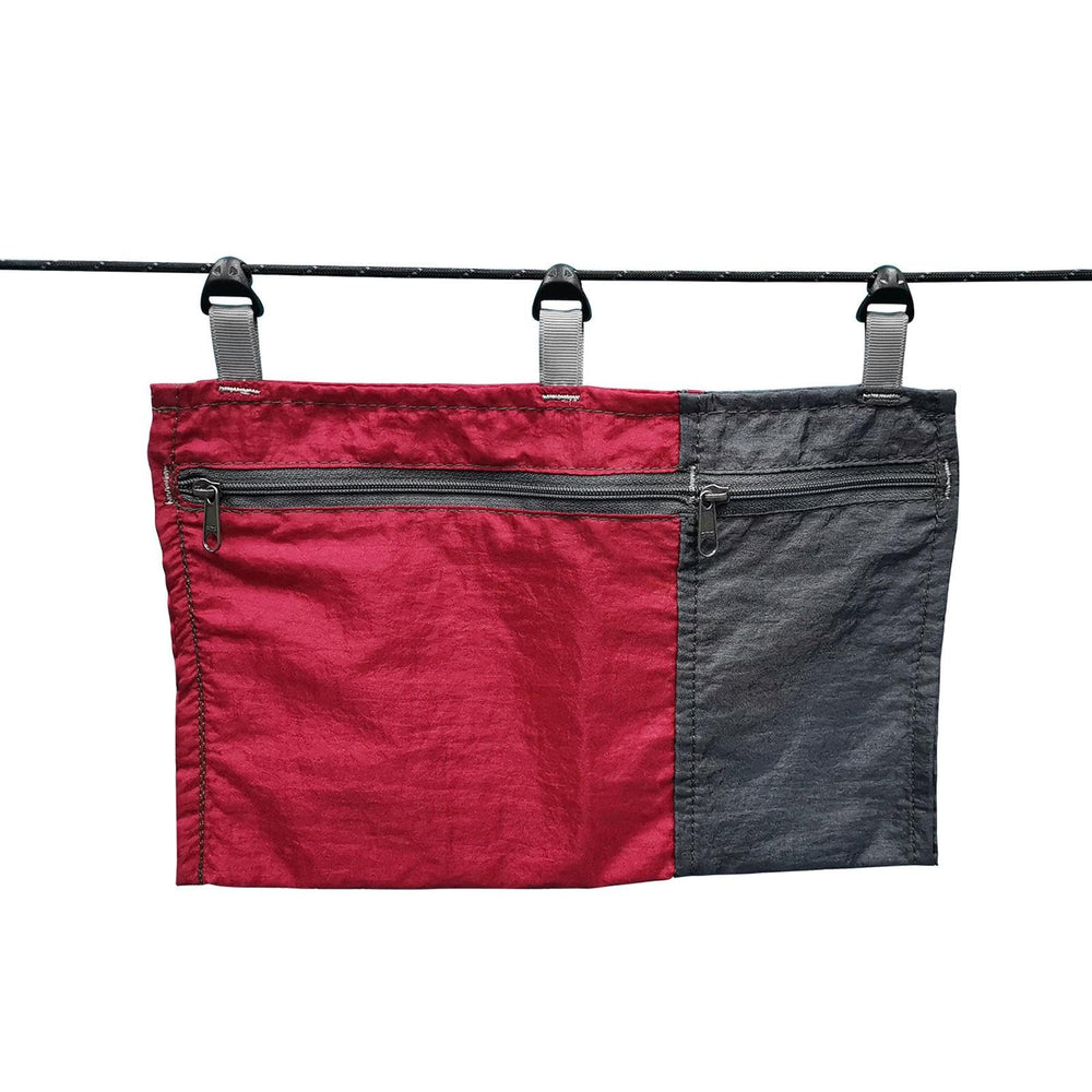 Amagogo hammock pouch attached to a tree with easy access during outdoor trips.