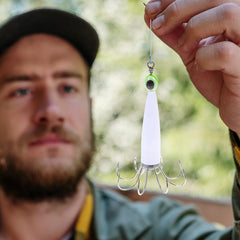 Anneome squid jig glow closeup emphasizes fine workmanship and vibrant luminescence.