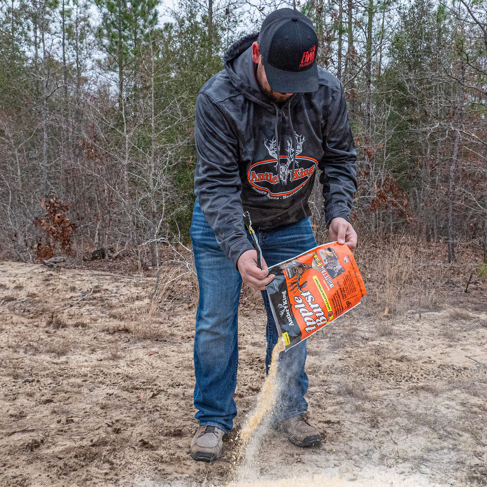 Antler King Apple Burst attractant near feeding trough to attract deer