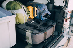 AO Coolers Stow-N-Go Carbon cooler under-seat fit demonstrates space-saving design.