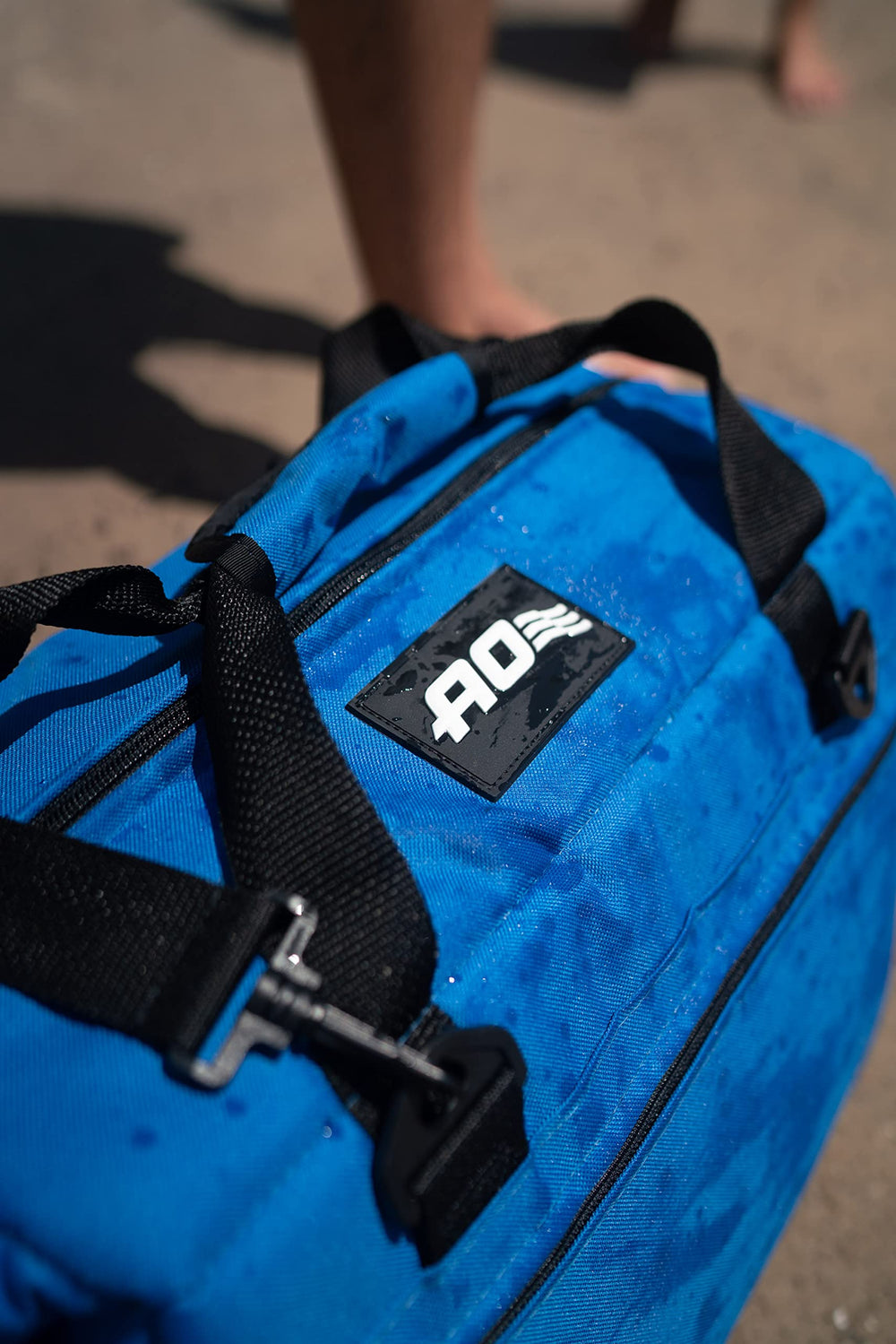 AO Coolers Traveler dry storage pockets hold snacks and gear.