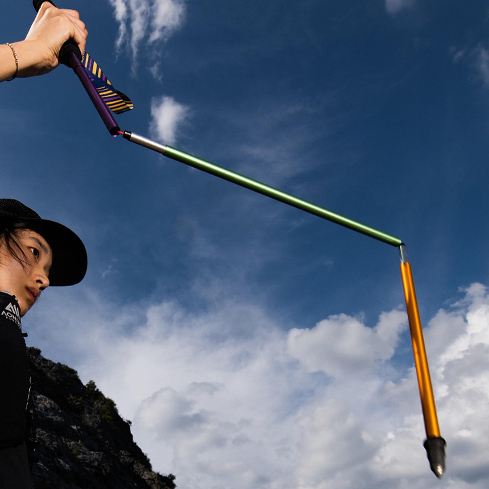 AONIJIE trail poles set to 120 cm for medium-height users on climbs.