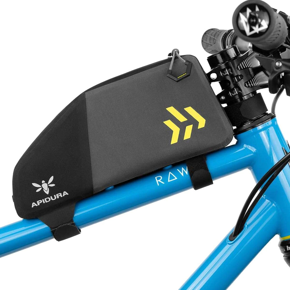 Apidura Backcountry Top Tube Pack secured by Hypalon straps for stable rides.