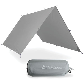 AquaQuest Defender Tarp coverage shields a campsite from rain