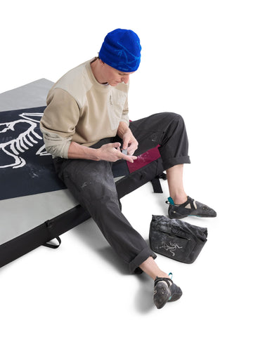 Arc'teryx Cronin left thigh drop-in pocket shown for harness-ready storage.