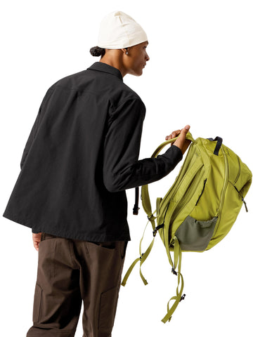 Side water bottle pockets with volume adjusters for flexible storage.