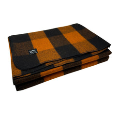 Arcturus orange buffalo blanket on campsite provides breathable warmth during cool evenings.