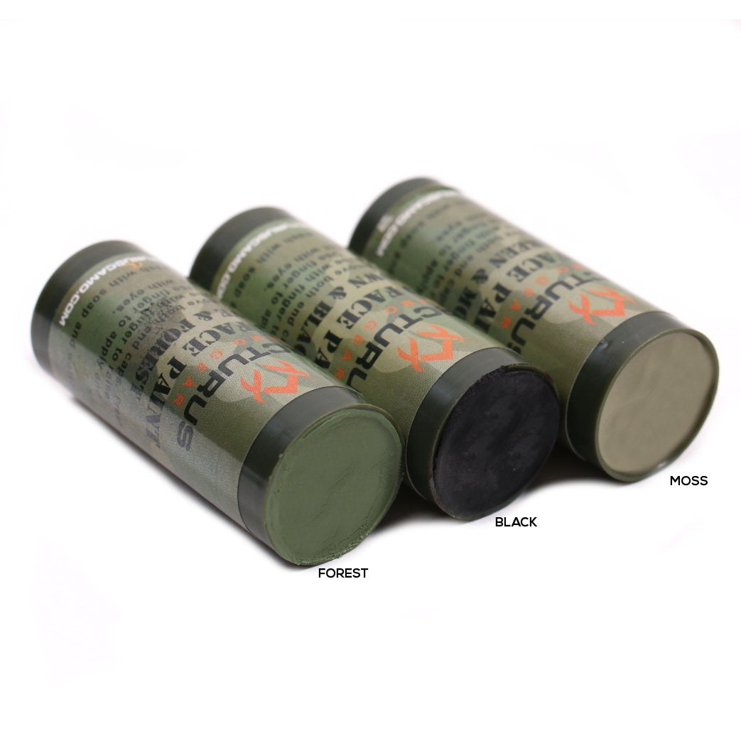 Arcturus camo face paint stick brown-black for high-contrast concealment in rugged terrain.