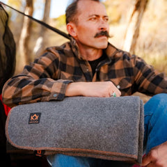 Arcturus Military Wool Blanket on camp table for dinner warmth and comfort.